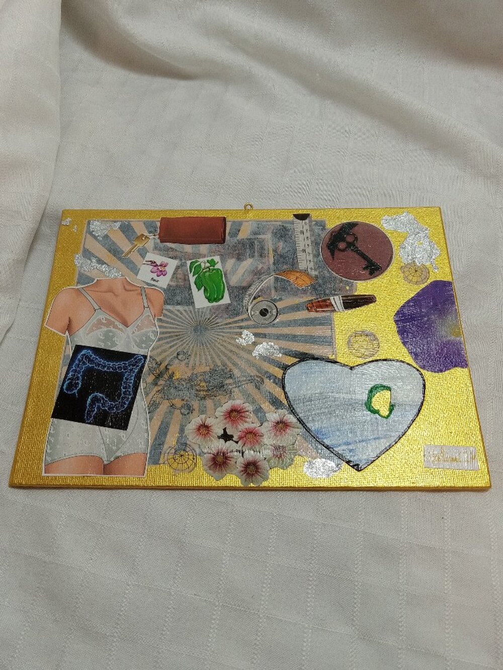 Prints of old magazines on canvas, gold paint, and mixed-media collages